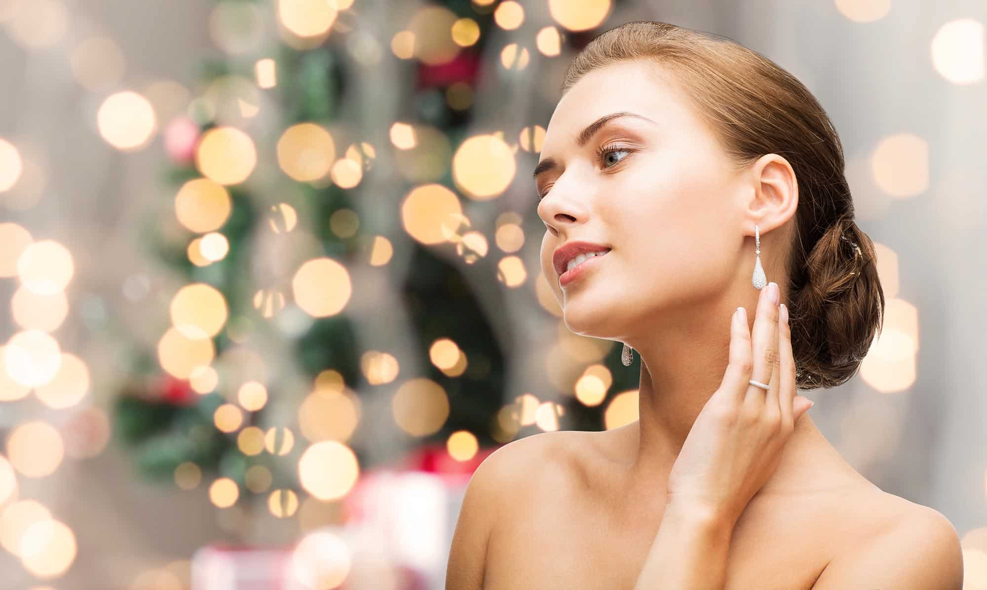 Women near Christmas Tree and sparkles